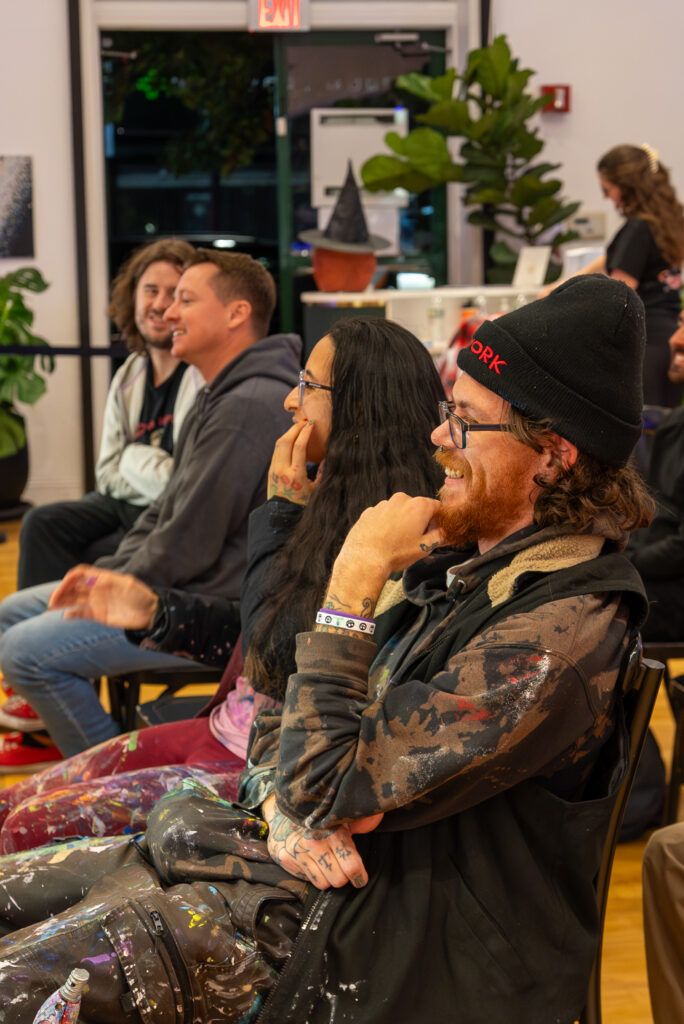 man from the audience laughing