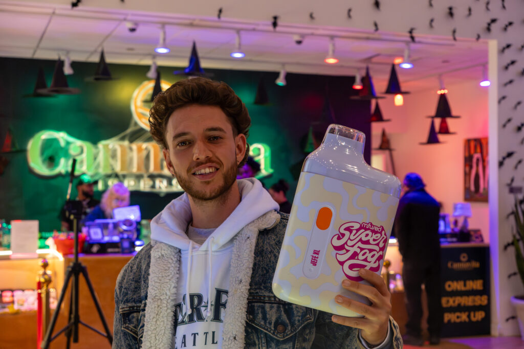 representative from a brand holding a giant vape